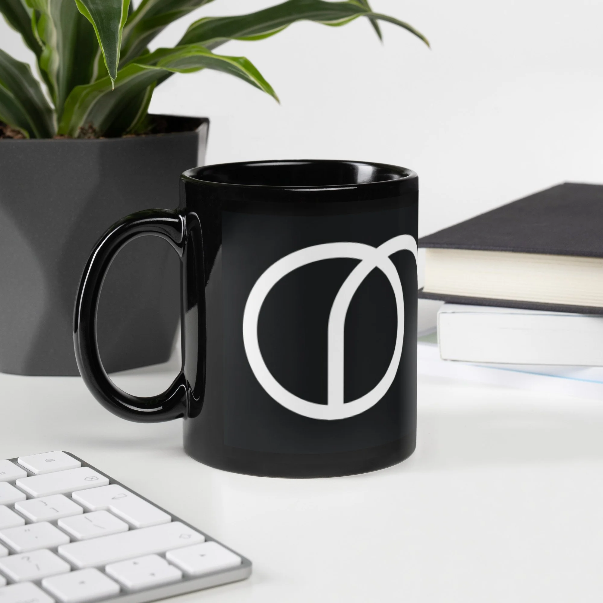 black-glossy-mug-black-11-oz-handle-on-left-keyboard.jpg