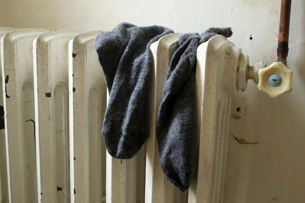 Socks on a radiator.