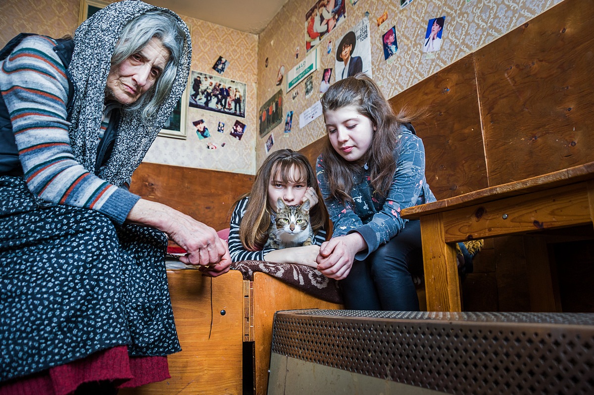 SOFIA • Liliya (71) takes care of Atanasiya and Dimana (both 14); all three live in one room during winter, with only an electric heater.   