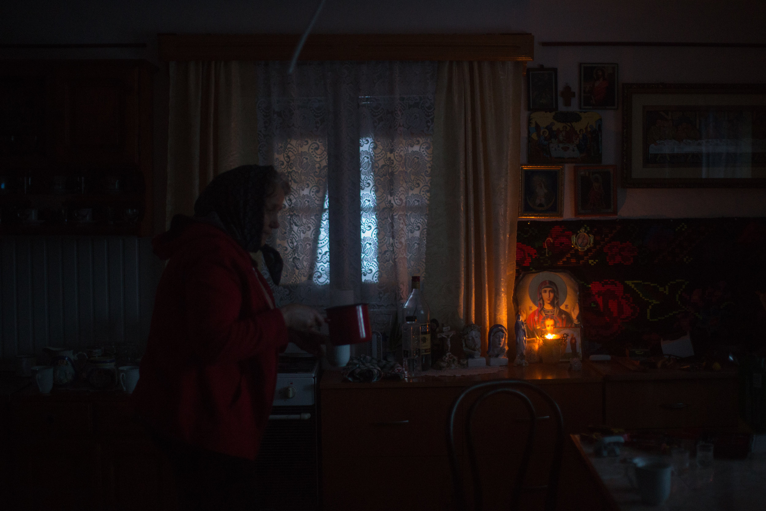 MOLODVITA •  Without a grid connection, Victoria and Vasile Procopiuc still use oil lamps; batteries for electric lamps, they say, would cost almost half their income.