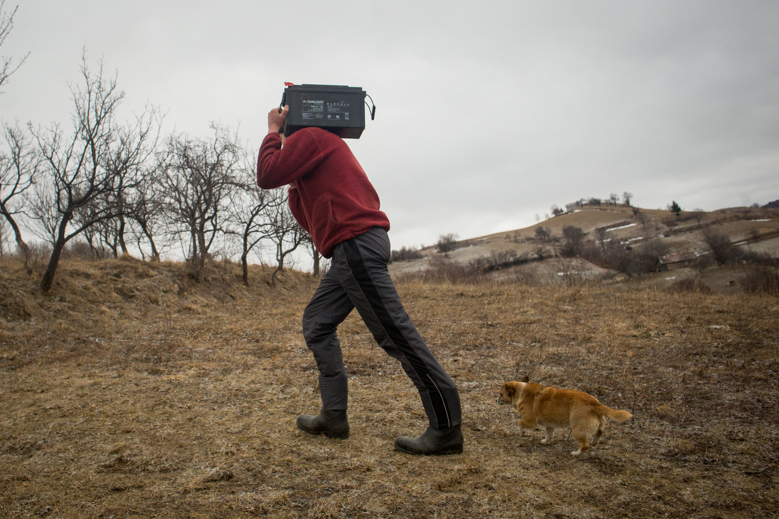 HOLBAV • While solar panels help, the batteries discharge quickly when Aurel Solomon uses lights and the radio; to save time, he'll drive to a village to recharge.