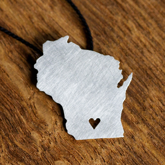 Wisconsin Shaped Silver Necklace hand-cut out of sterling silver with a cutout heart over Madison.