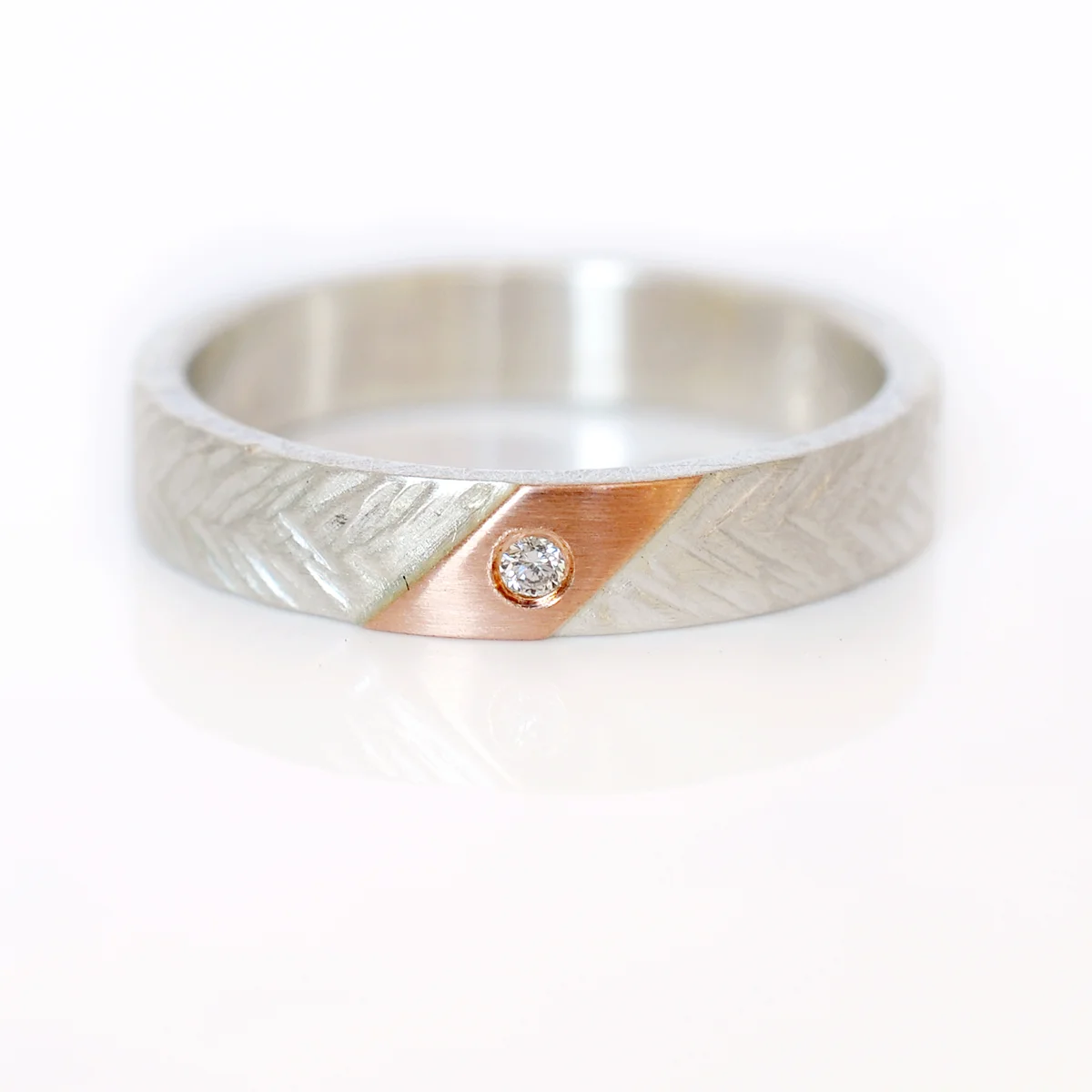 mixed metal textured sterling silver band 14k red rose pink gold accent flush set diamond stacking ring recycled metal alternative wedding handmade minneapolis mens womens unisex ring
