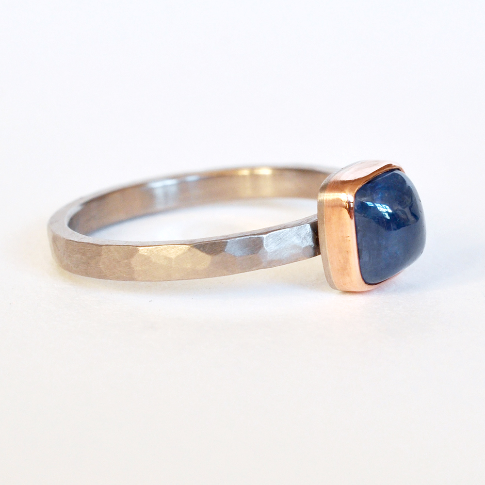 square cabachon blue sapphire solitaire 14k red rose pink bezel hammered palladium engagement ring recycled metal mixed metal conflict free stones handmade minneapolis alternative minnesota jeweler