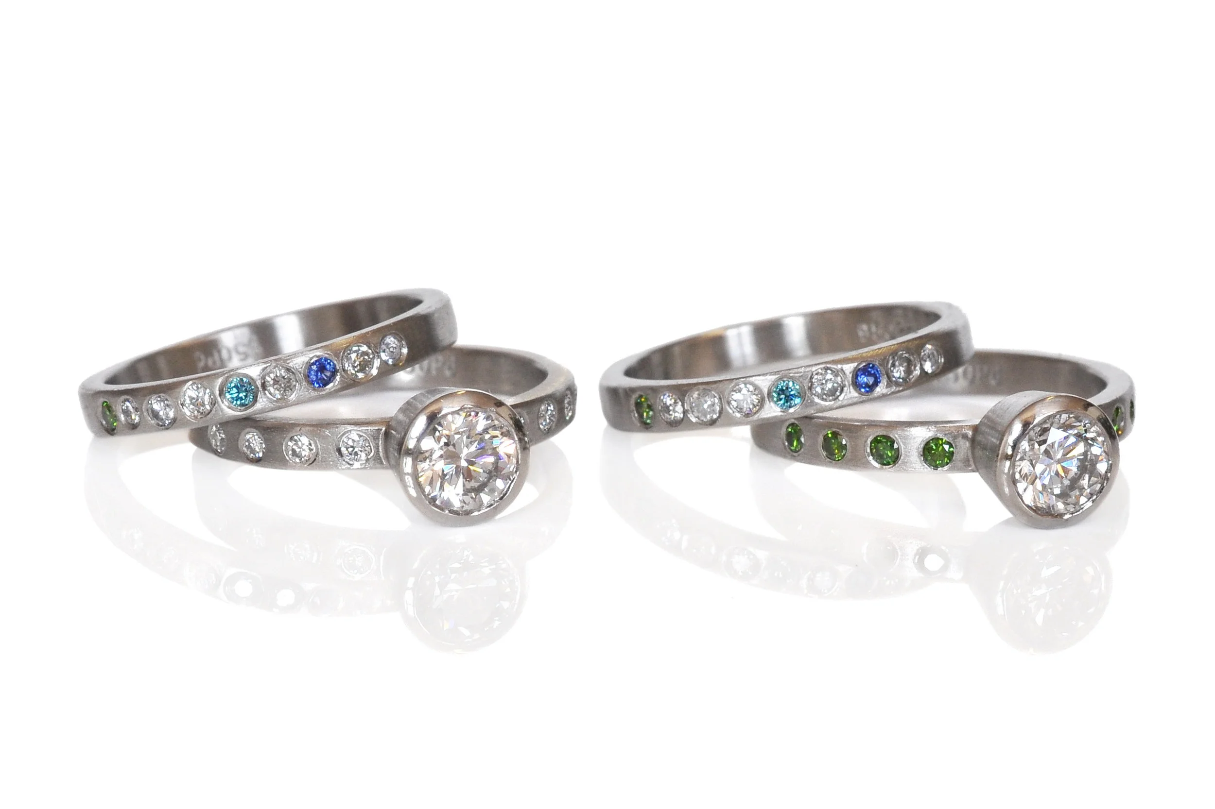 Colorful modern wedding sets with the birthstones of the family. 950 palladium with white diamonds, colored diamonds and sapphires.