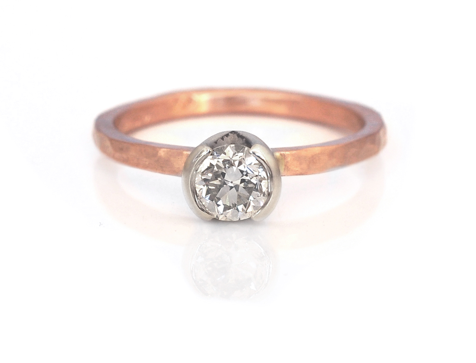 Ashley and Tyler chose a 1/2 bezel setting for their family diamond in 14k white gold and paired it with a hammered 14k red gold band. Simple and elegant.