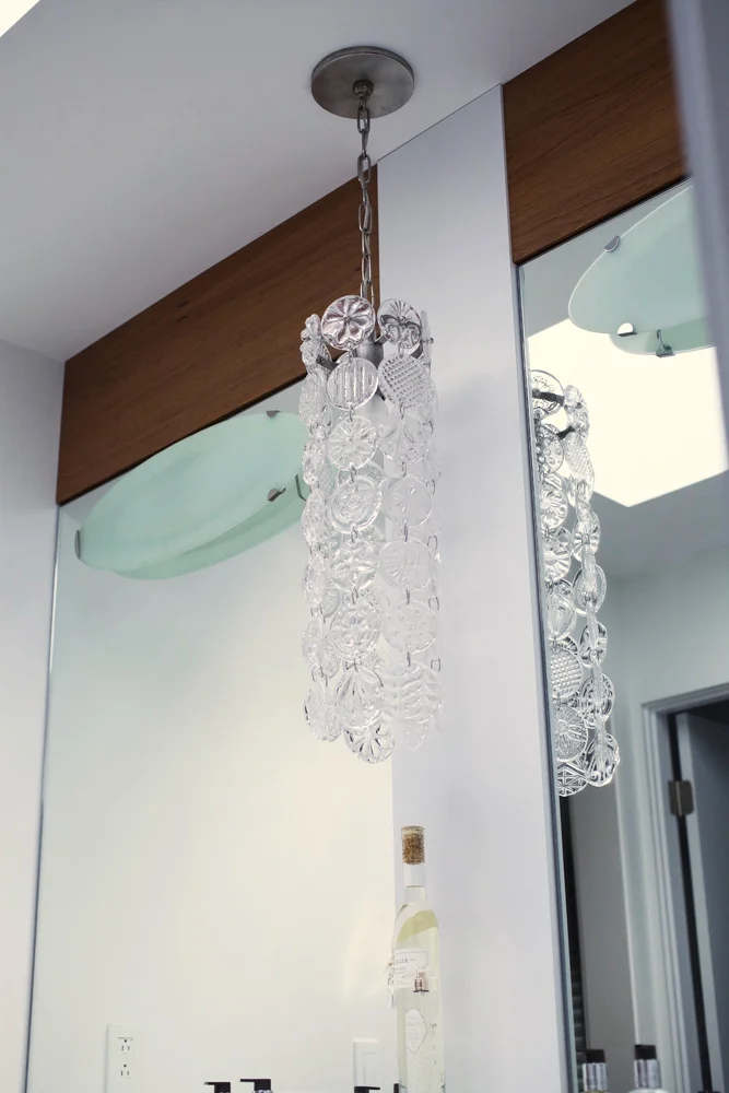 A Round Pressed Glass Chandelier in a private residence. Interior: Chris Leighton Design