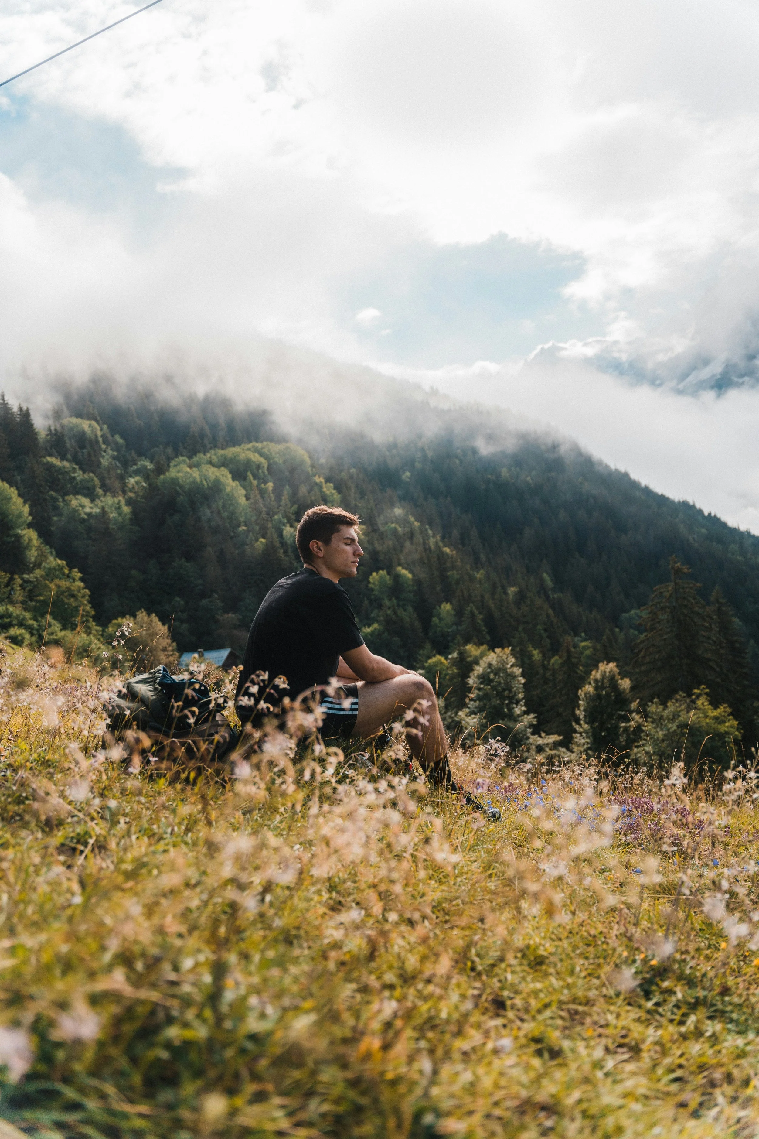Man sitting on mountain.jpg