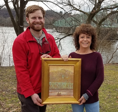Karen Harmon received her prize for the "Beauty" contest next to the Delaware River from Mark Zakutansky, Director of Conservation Policy Engagement at the Appalachian Mountain Club.