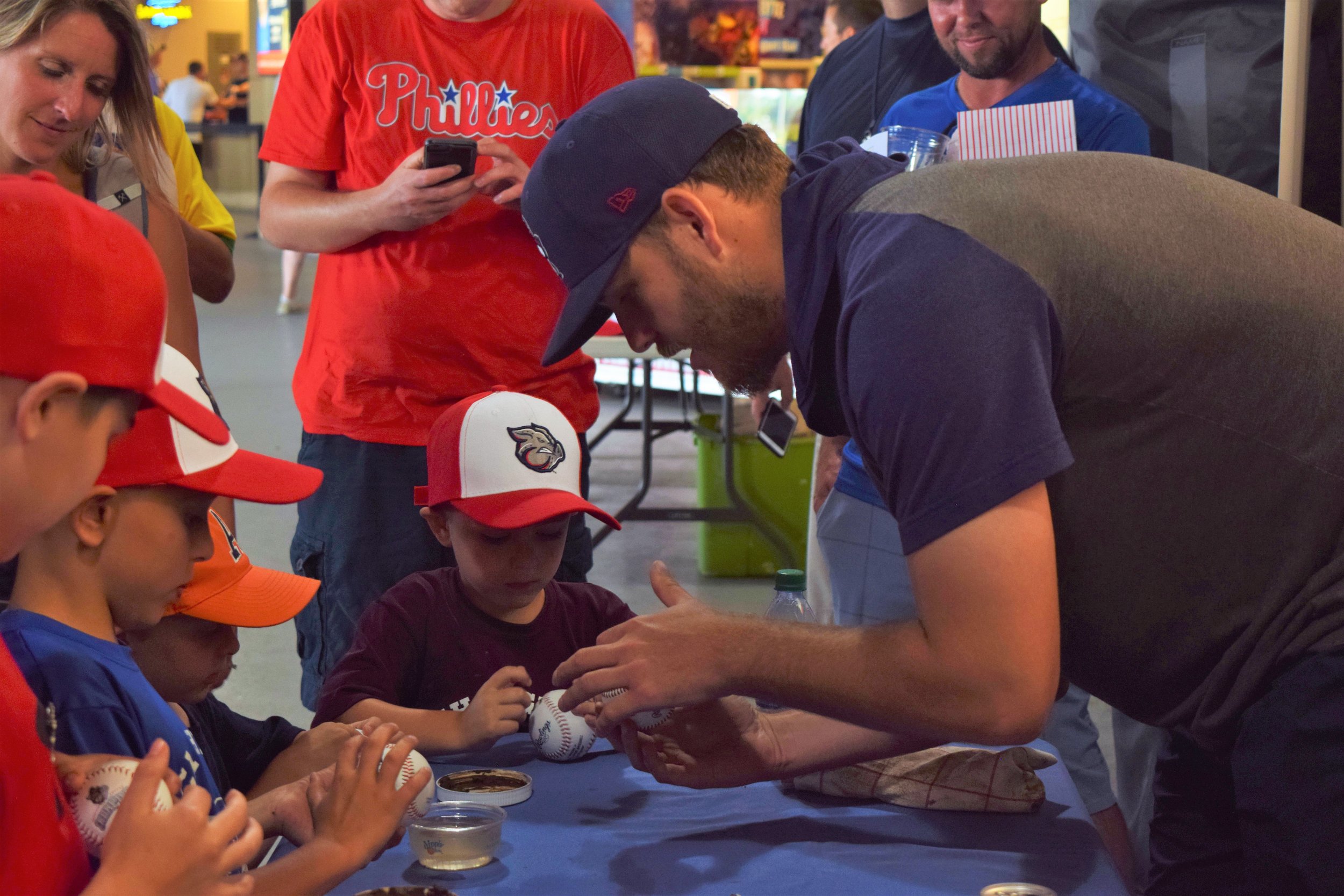 Iron Pigs pitcher Cole Irvin showing little leaguers how to properly ‘mud’ a baseball like the pros with Lena Blackburne Rubbing Mud from the Delaware River.