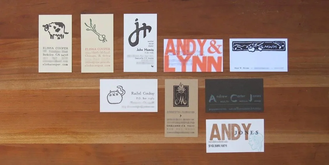 Business cards, circa 2002-2003. Contact information blurred for privacy. 