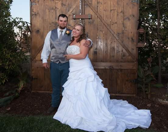  This is an A-line, worn with a hoop skirt underneath to give the dress structure. It is strapless with a beaded bodice, a lovely train with pick ups.&nbsp; 