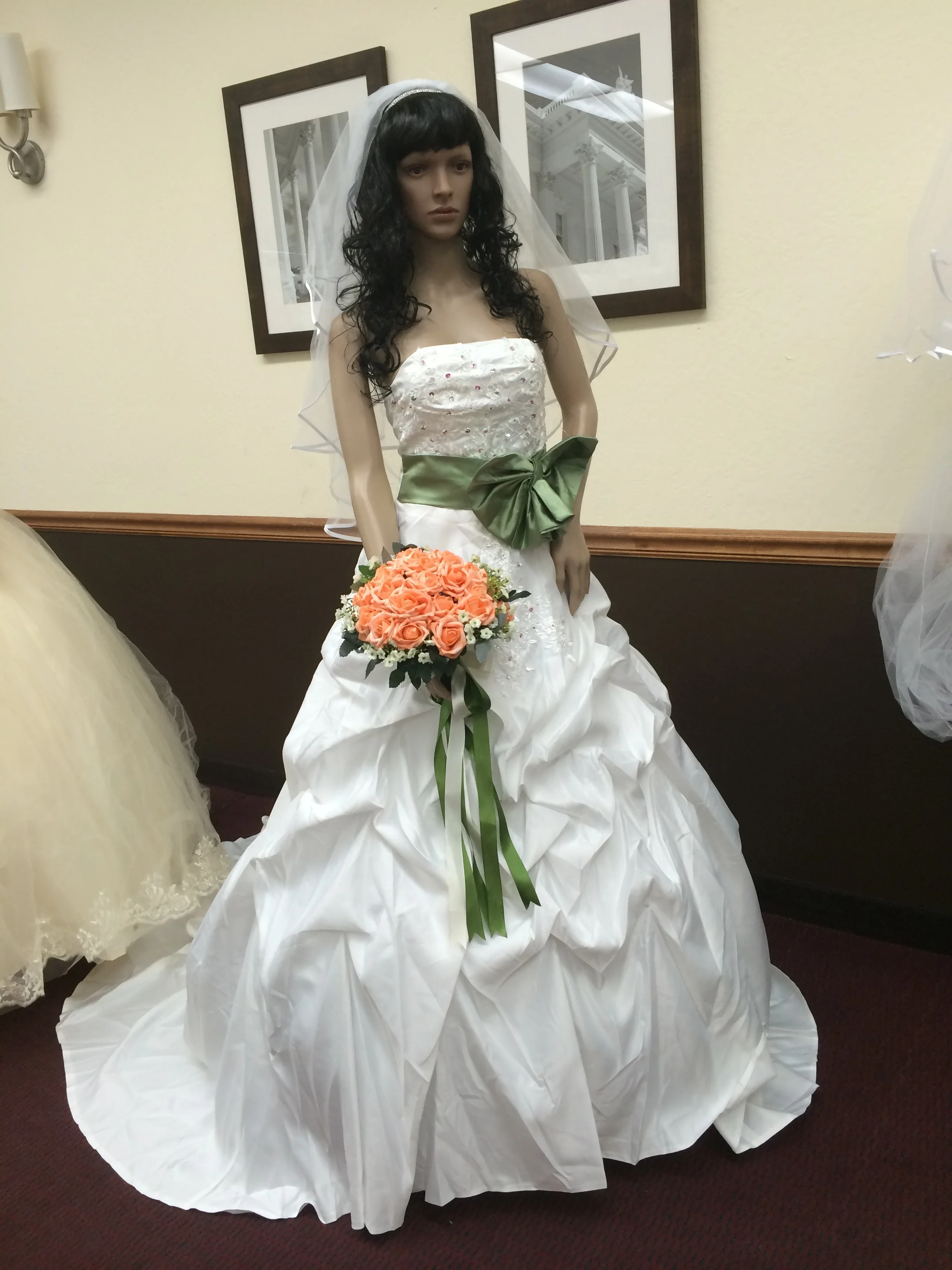  Strapless, hand beaded bodice, satin gown with a green belt/bow accent.&nbsp; 