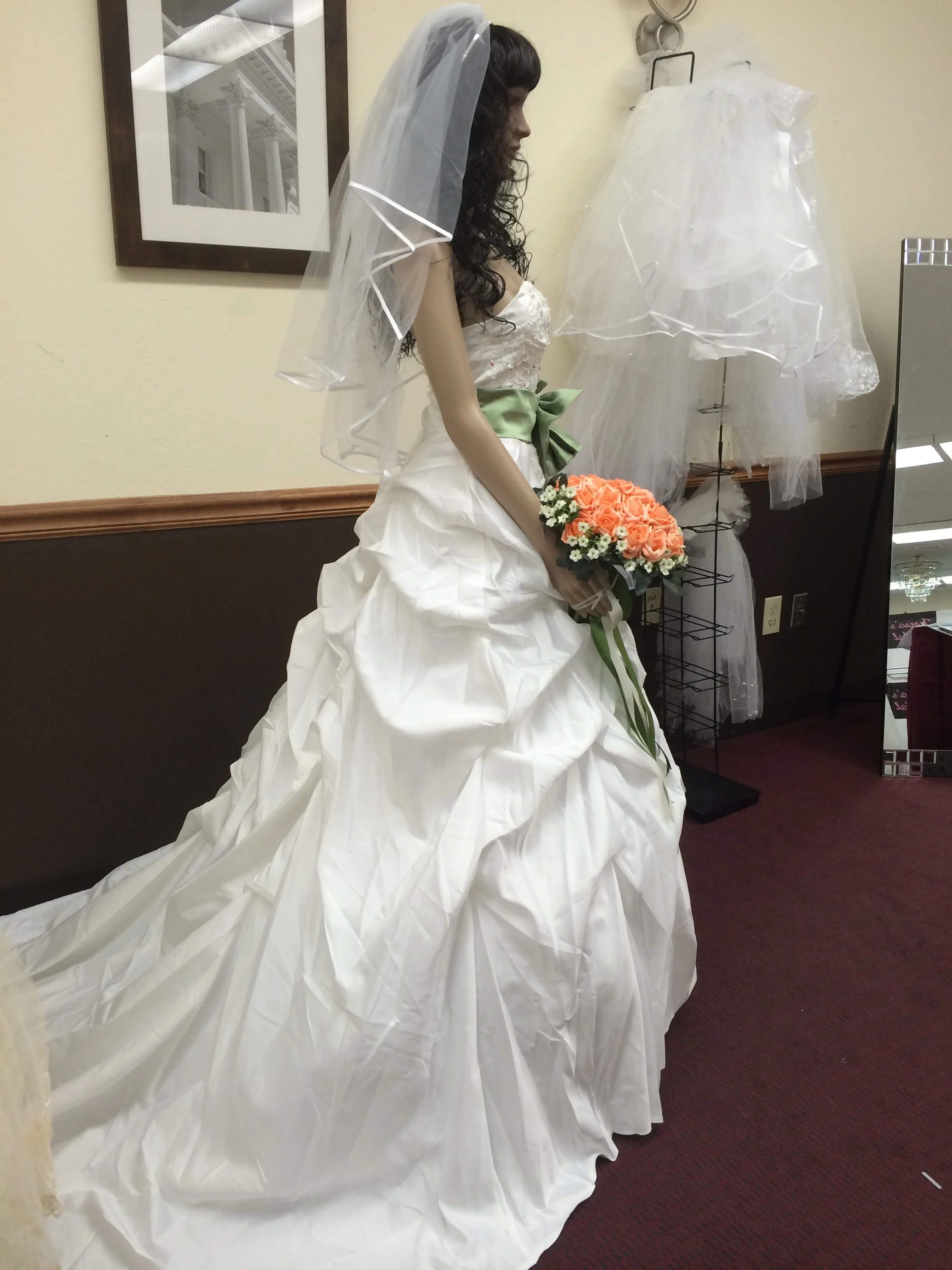  This gown is made of a rich , buttery satin.&nbsp; 