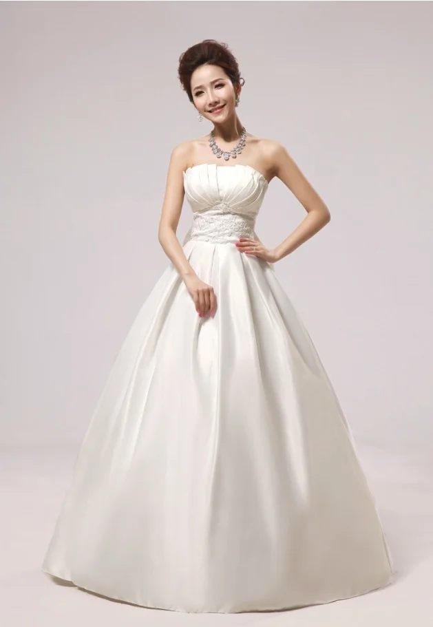 This is a classic satin ballgown with beading at the waistline and napkin folds at neckline. Very flattering. 