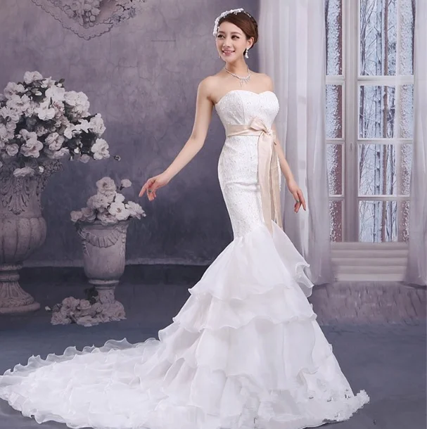  Hand beaded mermaid gown with a spectacular train.&nbsp; 