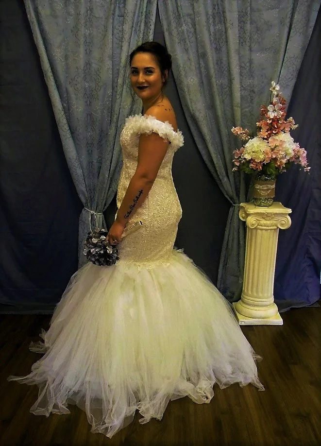  This is a trendy gown. Off the shoulders with a handkerchief skirt.&nbsp; 