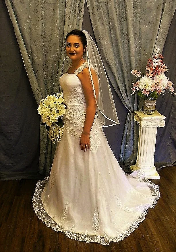  This A-line has double shoulder straps, detailing at bodice and an asymmetrical lace detain at the waistline with a lace edged hemline. Just beautiful.&nbsp; 