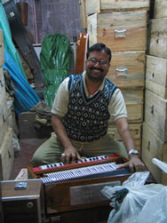 Technicians tweaking scale - changers at Monoj Kumar's