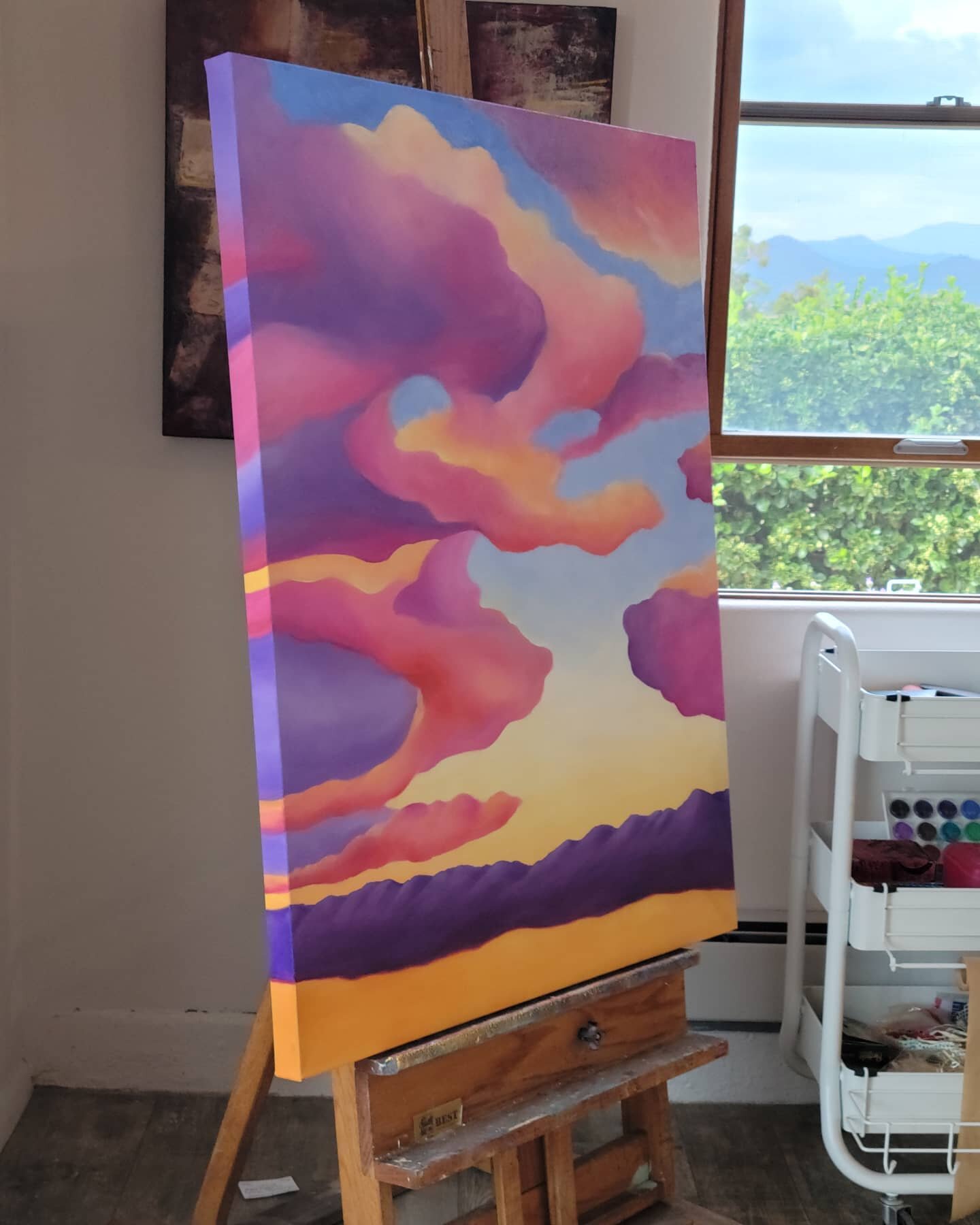 I love painting the edges of the canvas...brings the piece together. Also enjoy the view of the Sangre de Cristo mountains out my studio window. #sunsetpainting #santafeskies #colorfulabstractart #contempoaryartist #abstractartist #desertsunset #onth