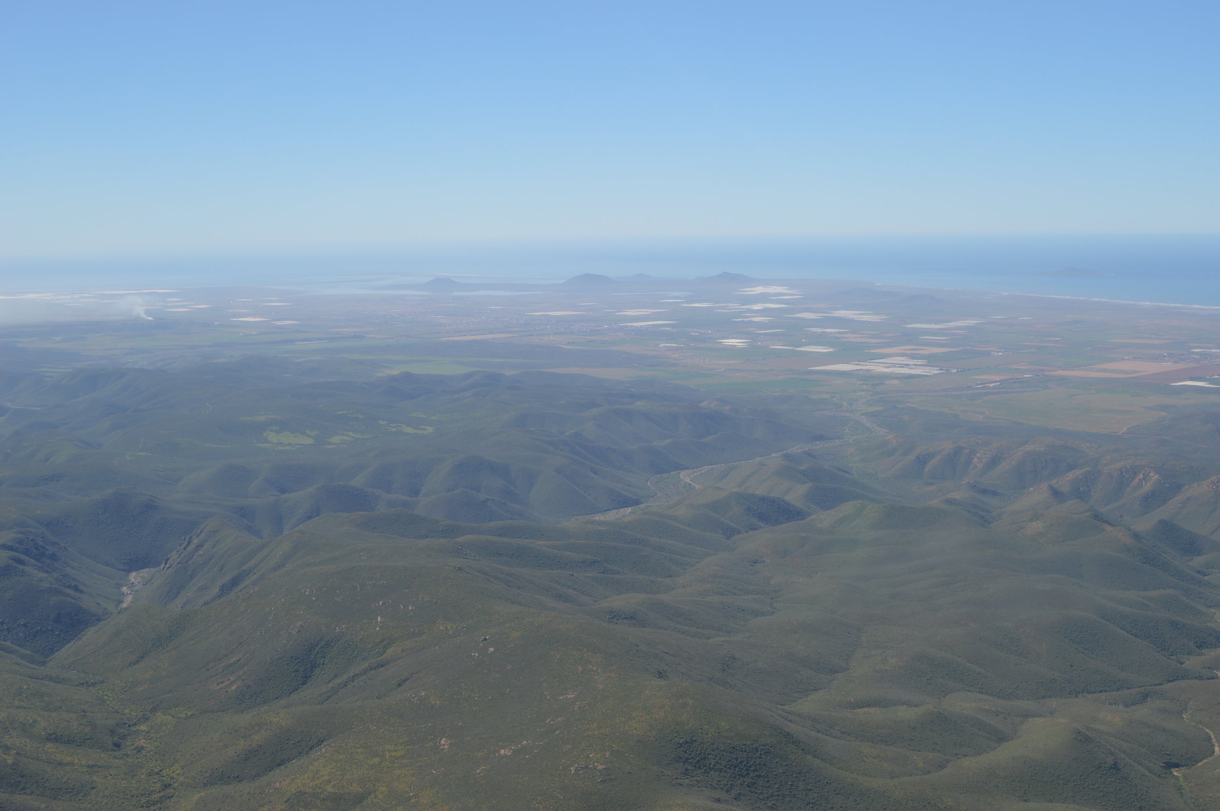 Aerial view of Sierra de San Pedro Martir Mountains, Sea of Cortez in background.