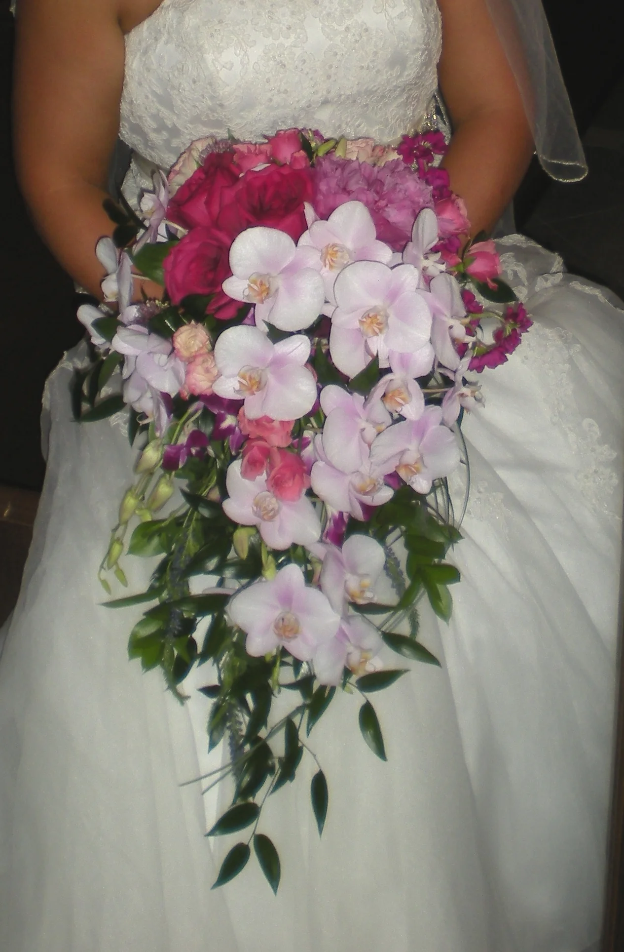 cascade 00093 victoria-with-cascade-bouquet---phalaenopsis-orchids-peonies-spray-roses-dendrobium-000139_19066347515_o.jpg