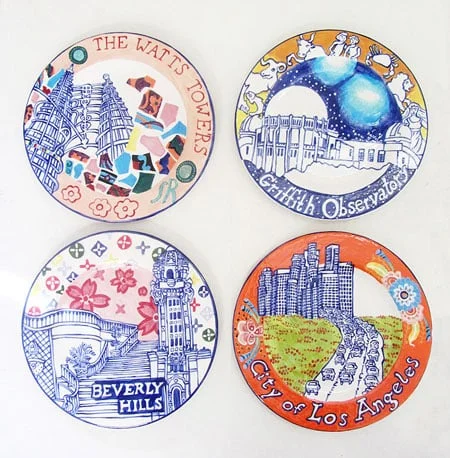 Karen Koblitz LA Landmark Series Plates. Each plate is 8.25" and is made of low fire clay and glaze. The plates are titled: Beverly Hills, City of Los Angeles, The Watts Towers and Griffith Observatory.