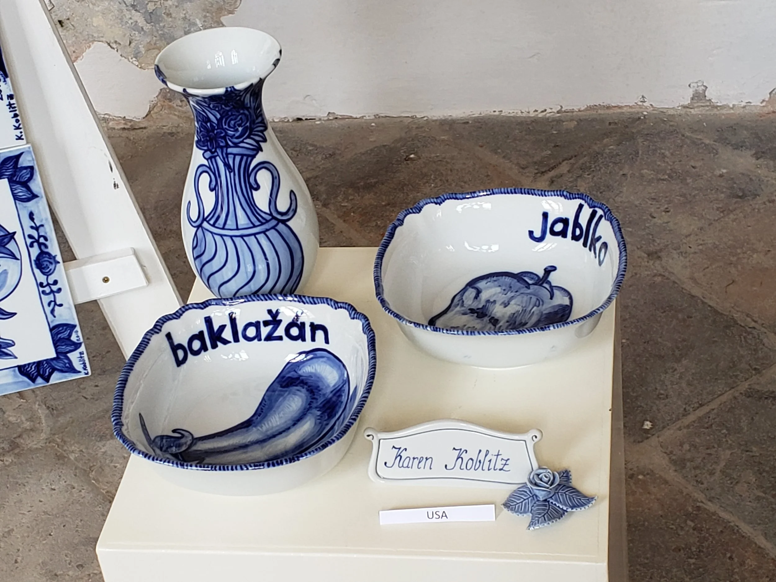 Installation detail, vase and bowls (eggplant, apple)