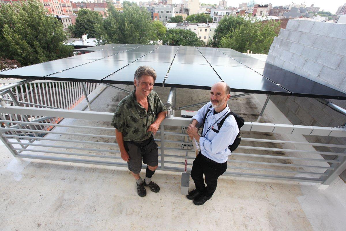 Ray Sage and Paul Castrucci, the developers of Brooklyn’s "Passive" House, show off their solar panels (BYRON SMITH/FOR NEW YORK DAILY NEWS)