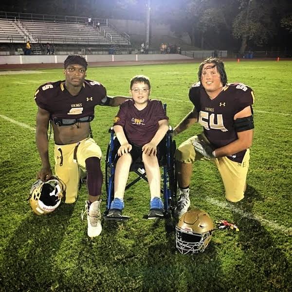 Saint Elizabeth's Christopher Cropper and Mickey Henry with Muscle Champion, Max French