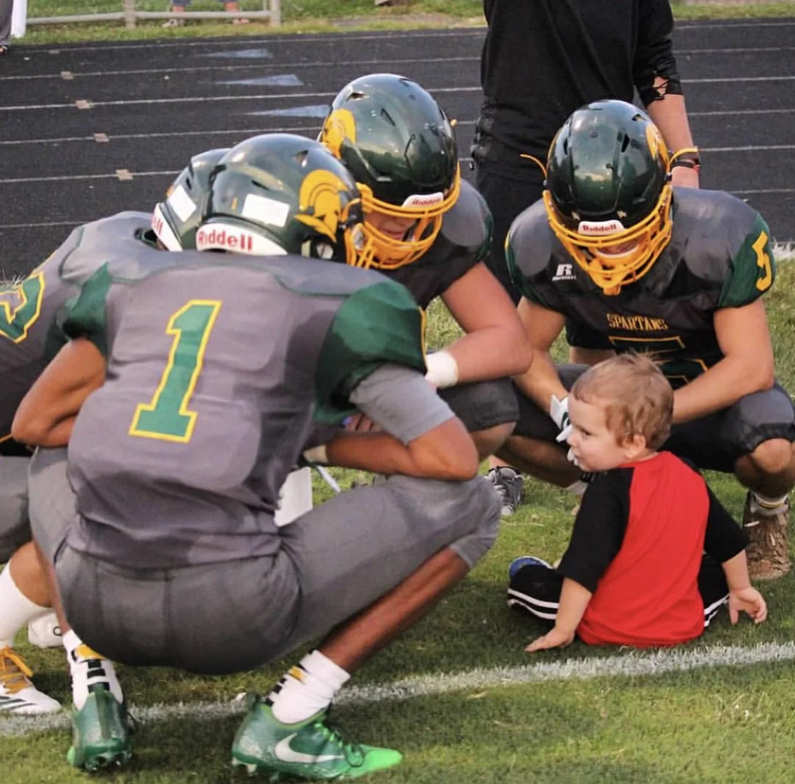 2017 Spartan Captains take a moment to welcome MMF Muscle Champion, Roman Graham, before the game!