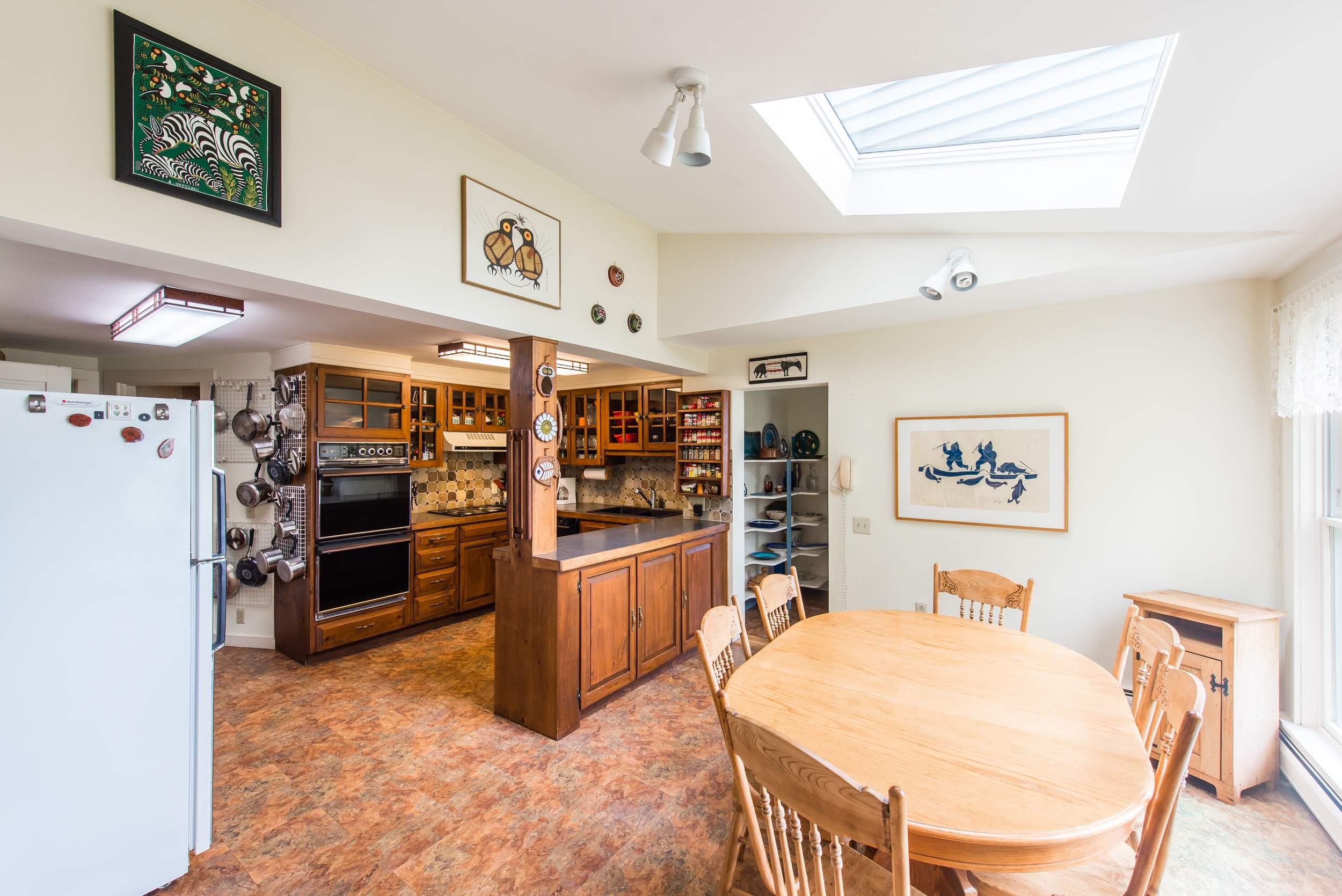  Large, well equipped kitchen with breakfast table and ocean views. 