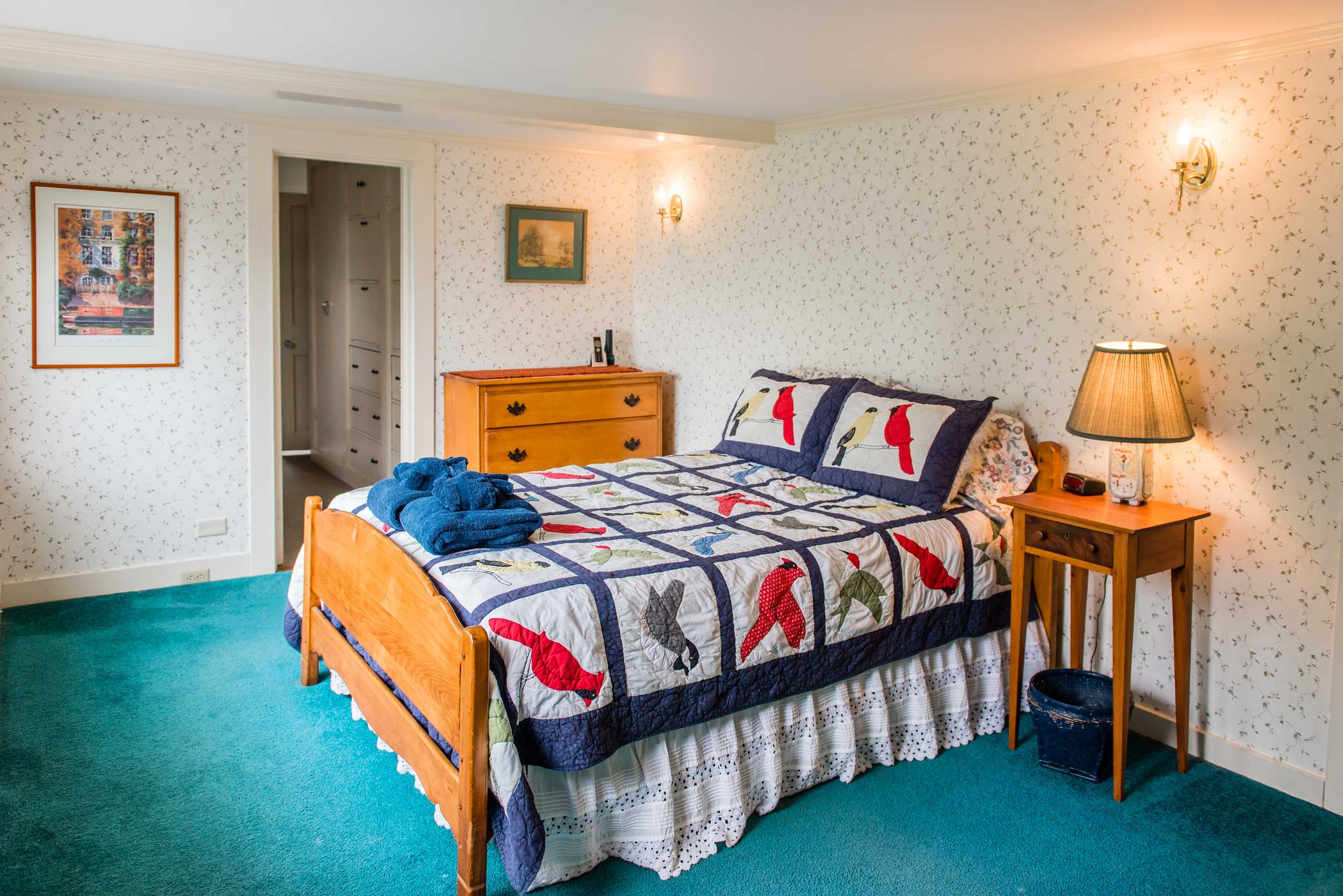 Upstairs bedroom with double bed and ocean views. 