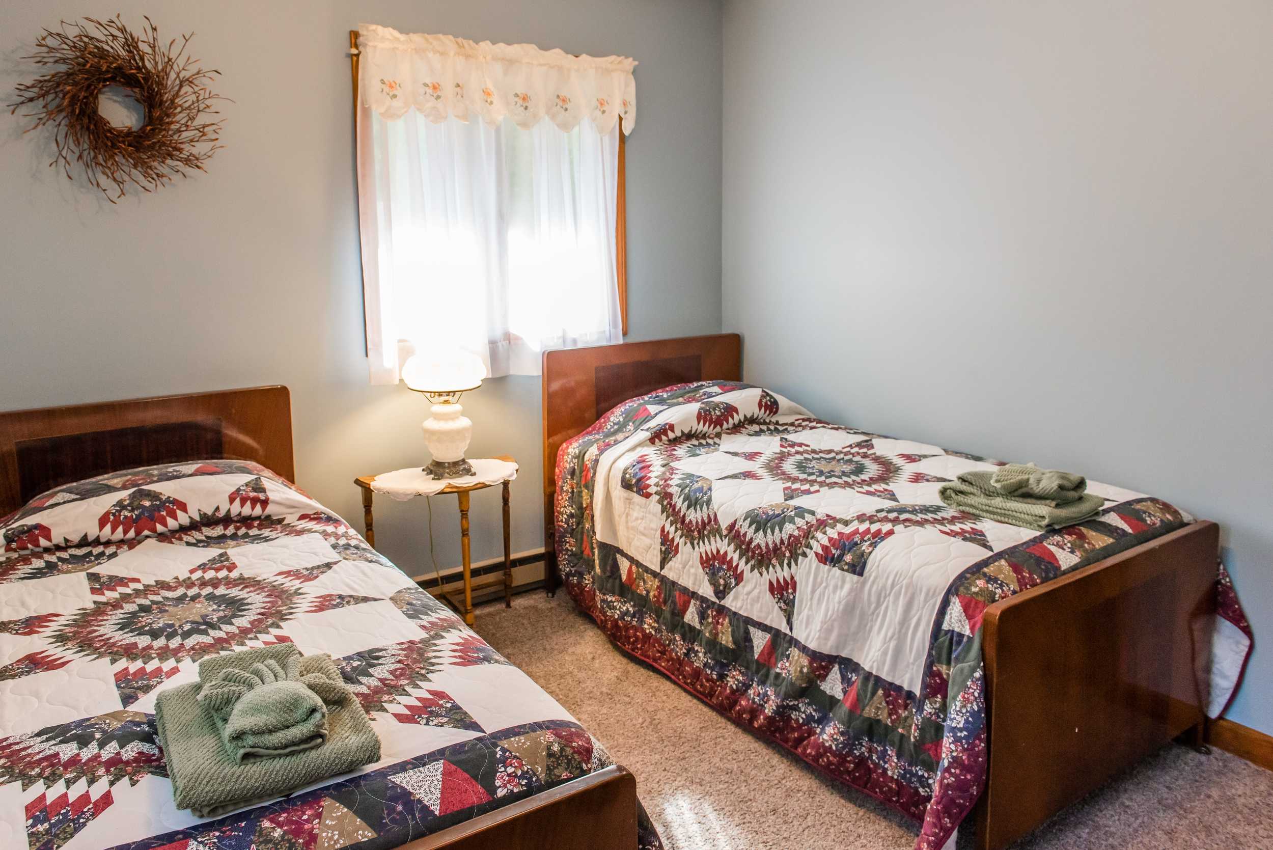  Upstairs bedroom with two twin beds. 