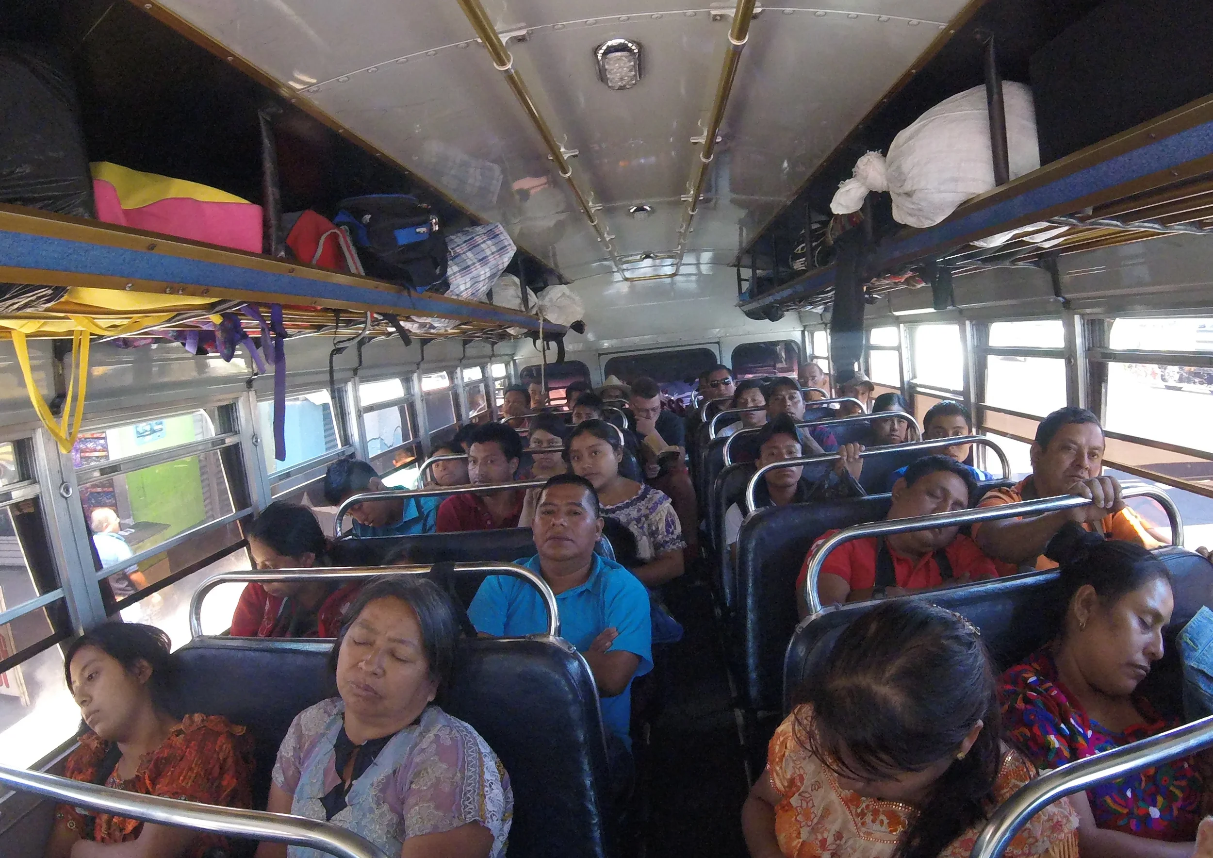 Sleepy Guatemalans and me wedged in at the back