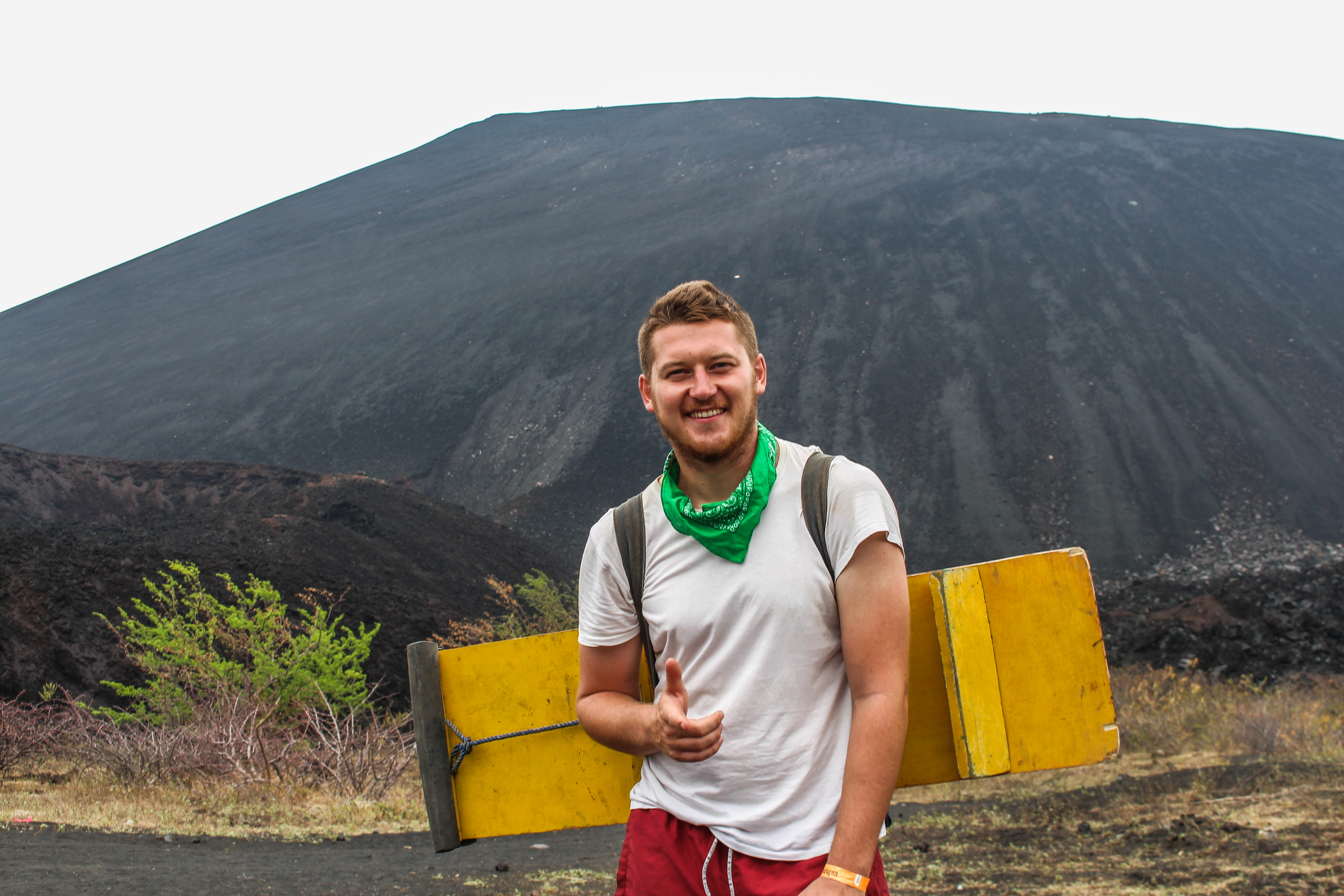 A British volcano boarder stands at the foot of Cerro Negro