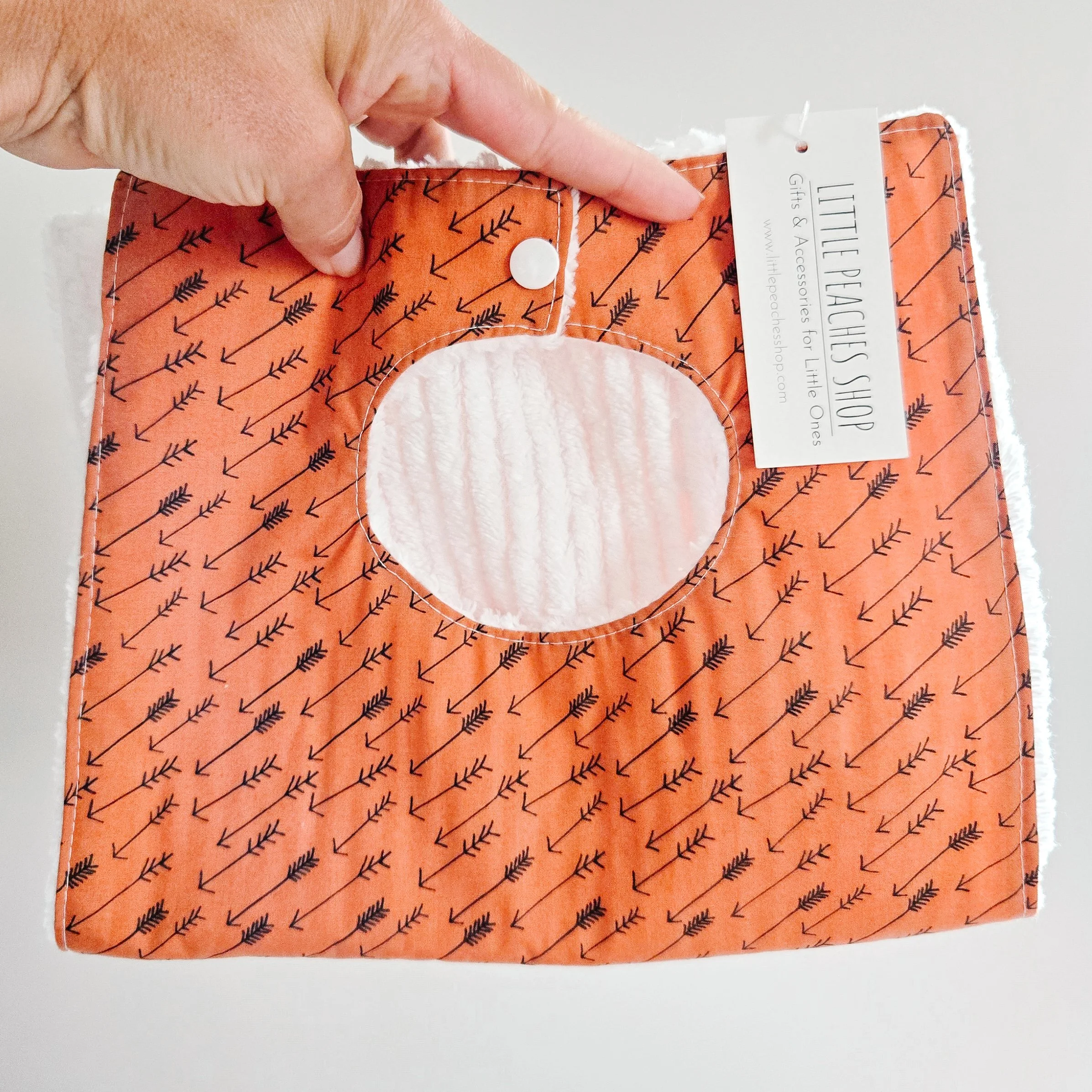 The Crumb Catcher Bib in Clay Arrows