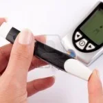 7519846-woman-pricking-her-finger-for-a-blood-test-with-a-glucometer-in-the-background-150x150.jpg