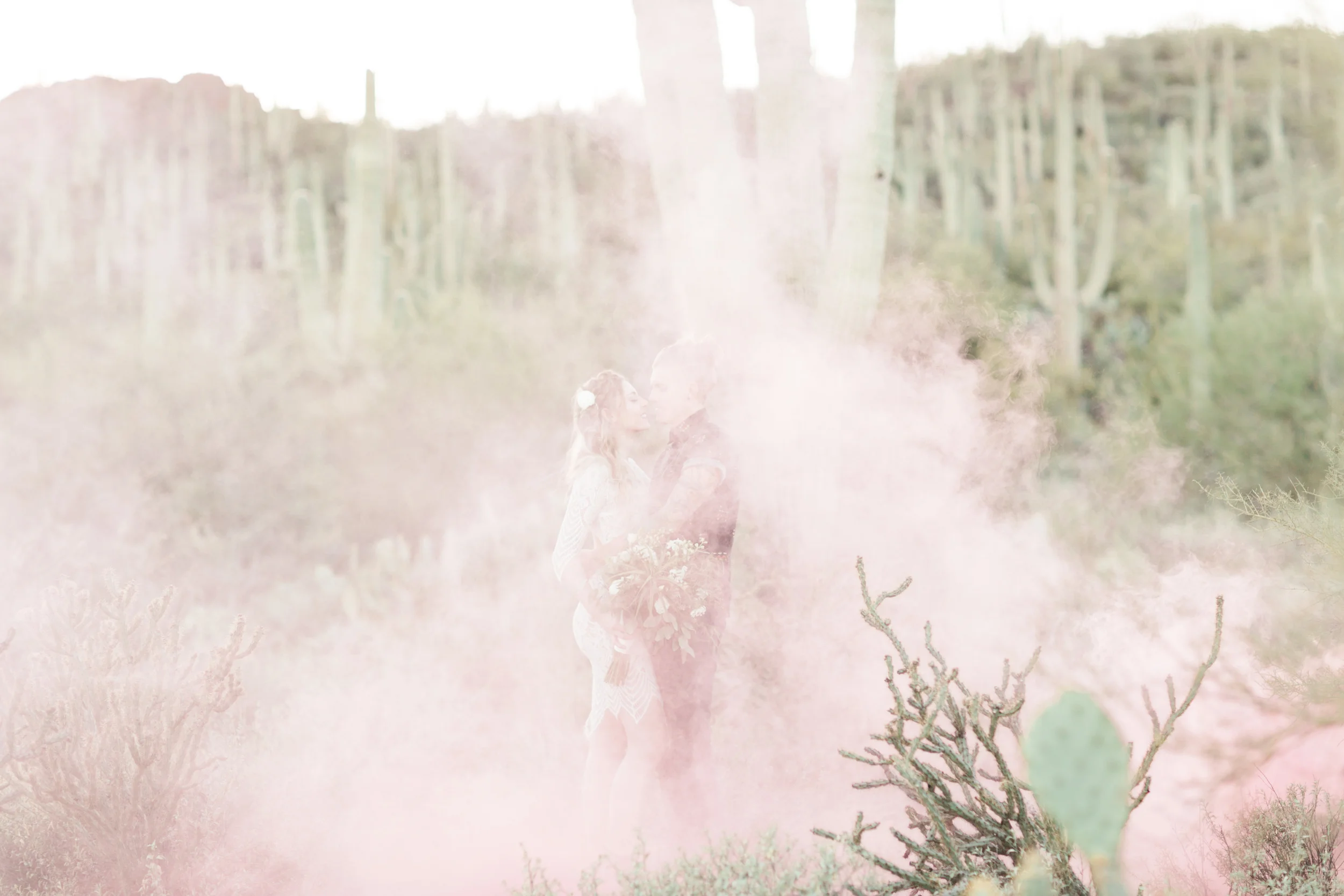 Pink smoke bombs in the desert