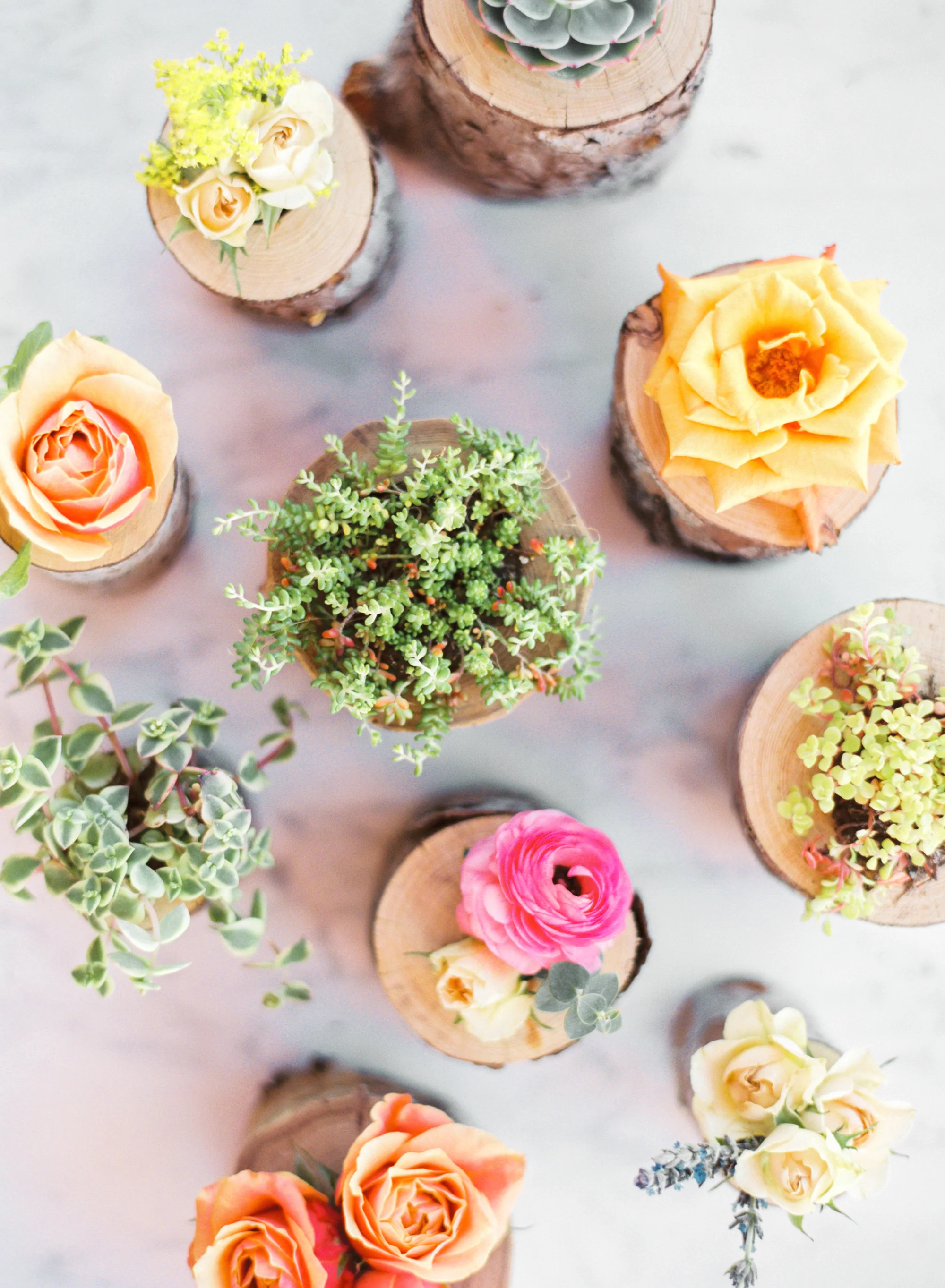 handcrafted tree branch vases filled with florals