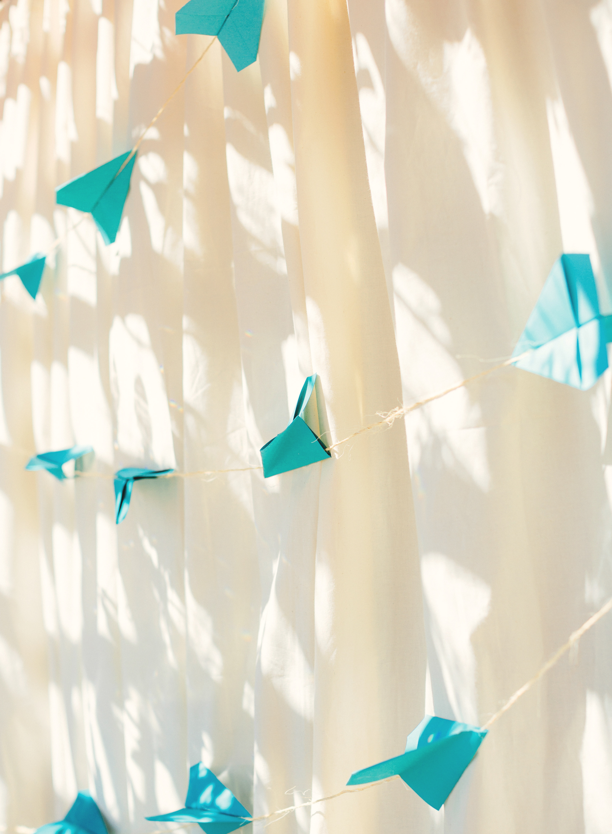 Paper airplanes backdrop for the cake table