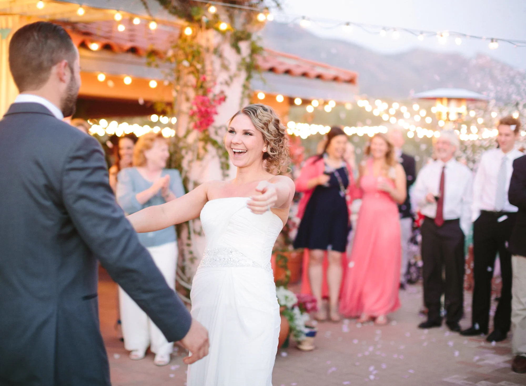 First dance with cafe lights and confetti