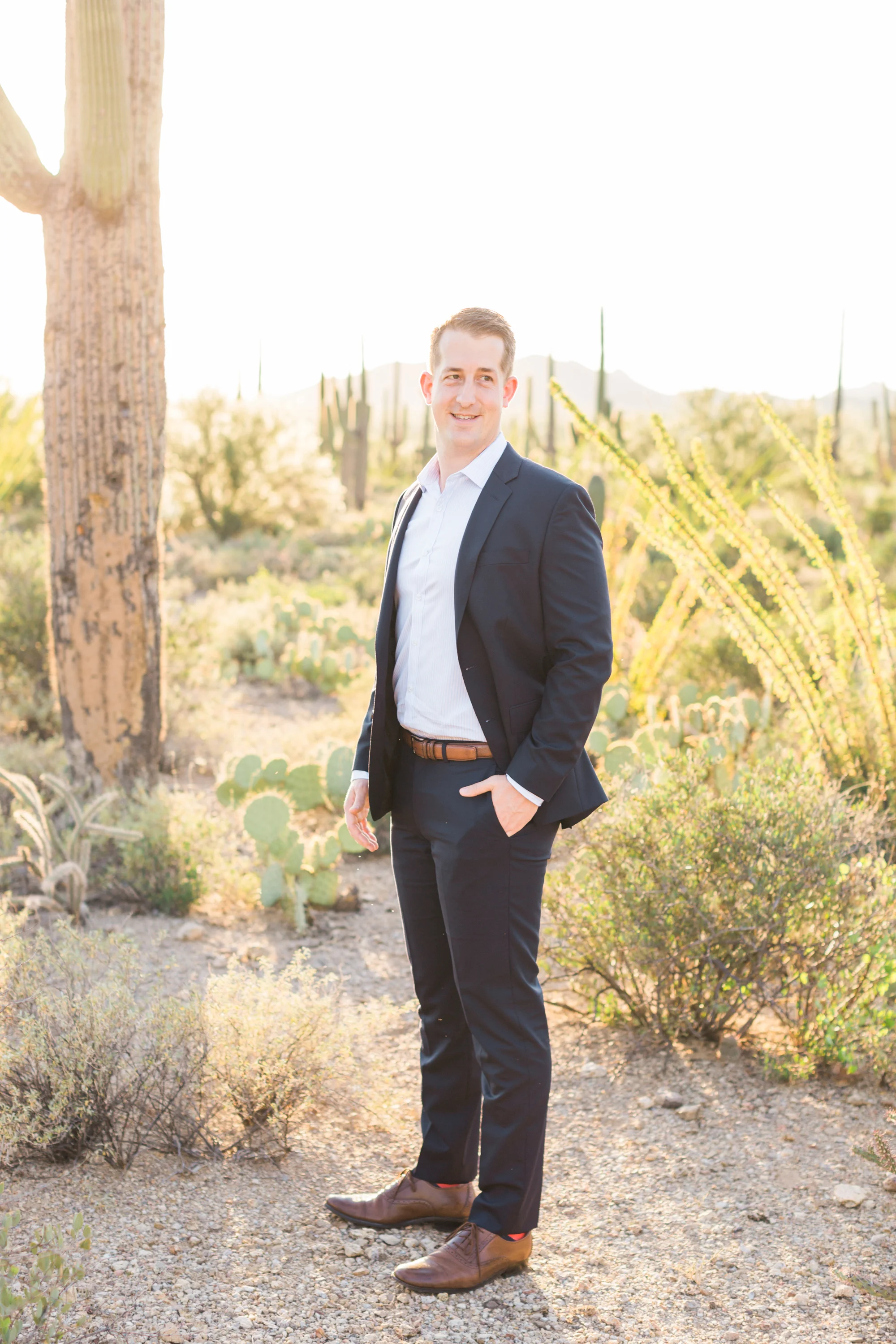 Handsome guy in suit with cactus in the background