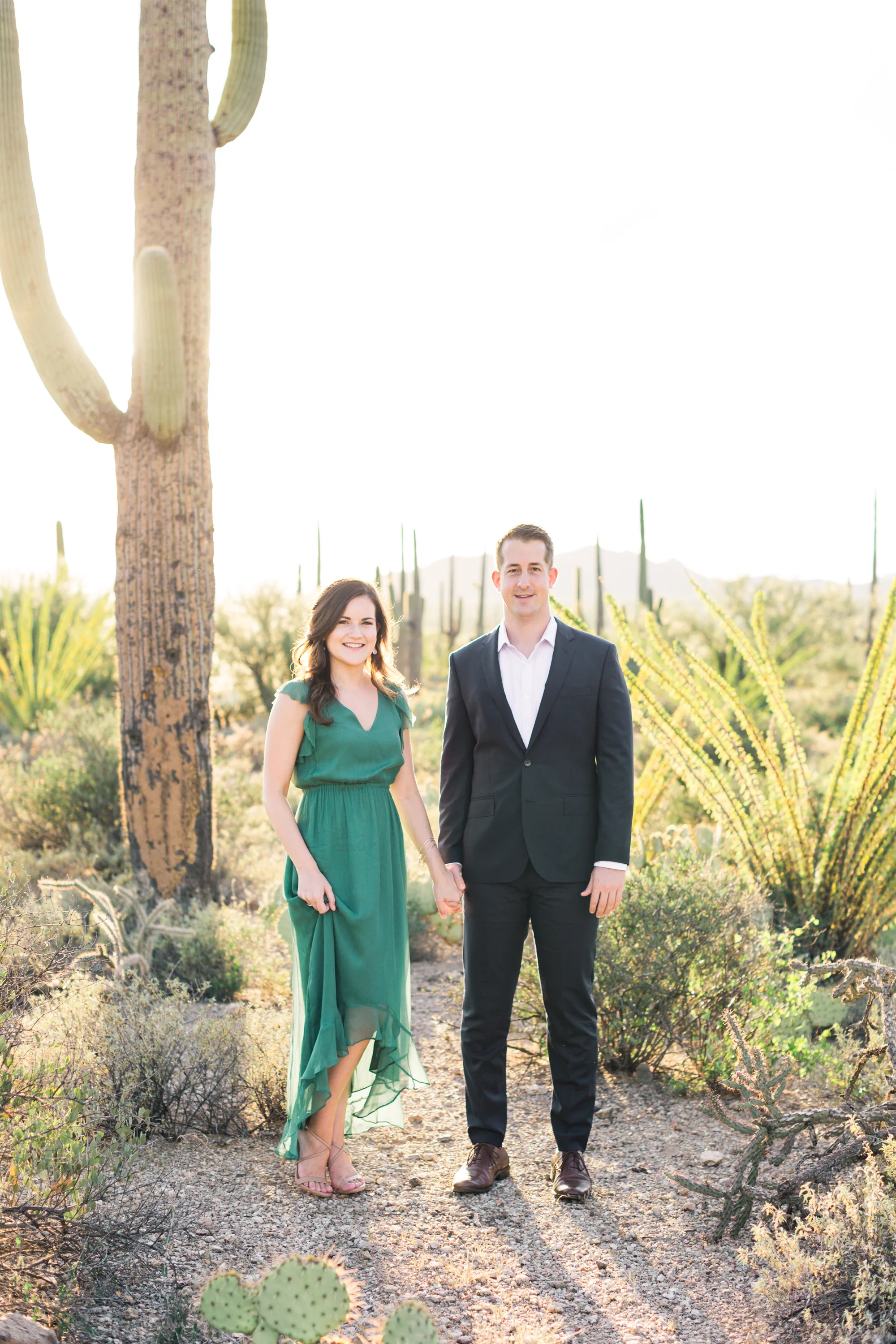 We love their outfits Alyssa & Dave chose for their engagement session. Her green dress compliments the gorgeous desert gorgeous desert tones perfectly.