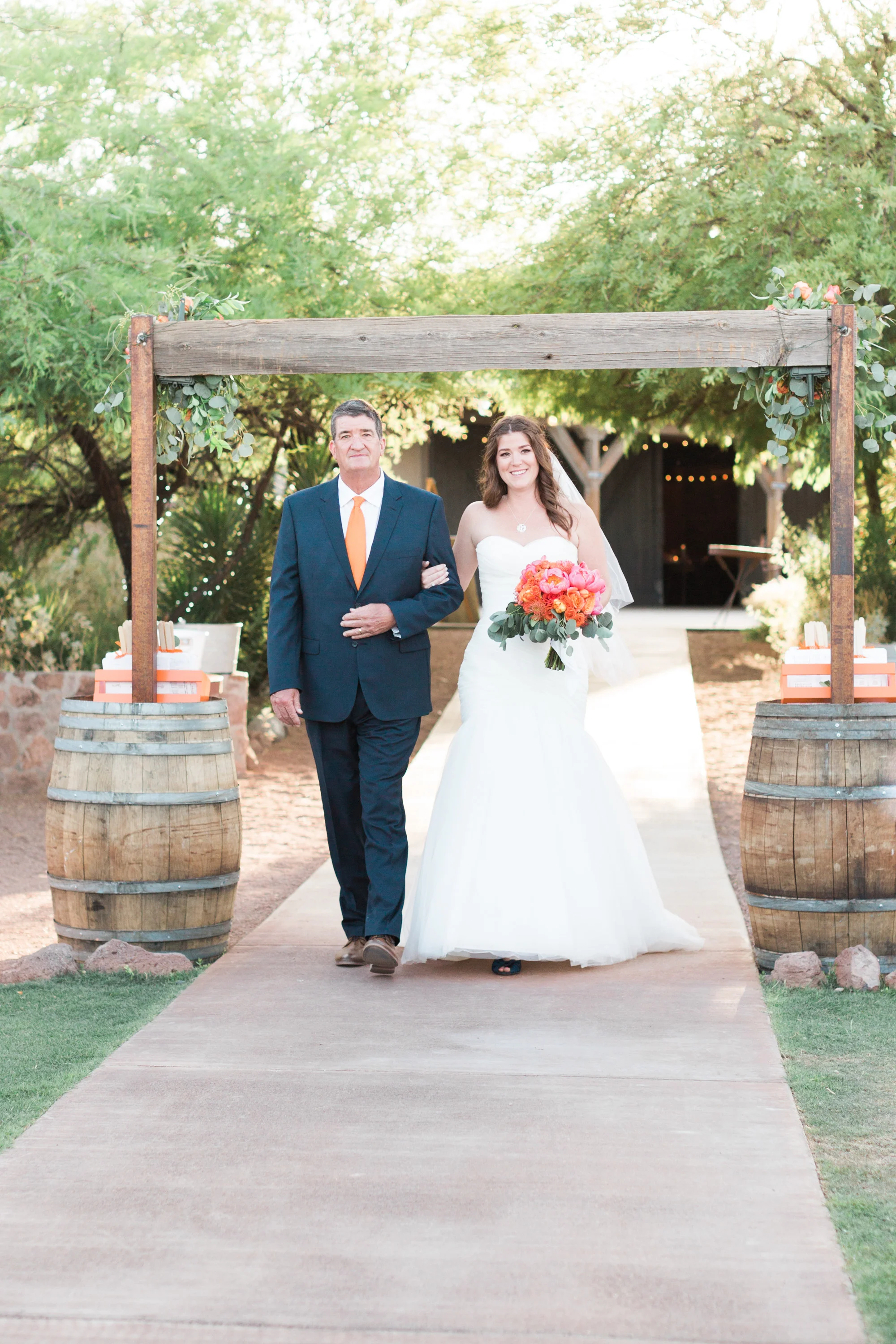 Bride and her dad walking down the aisle.