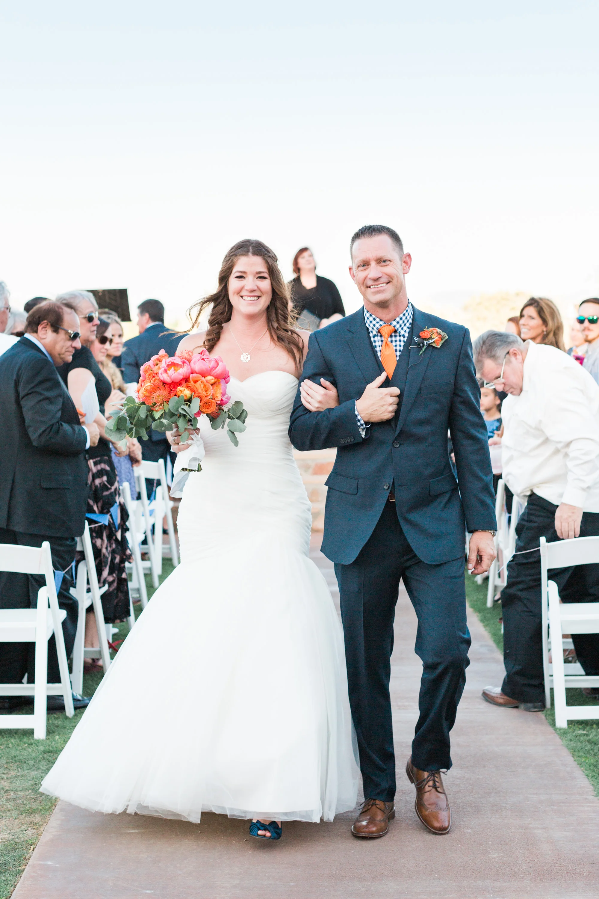 Bride and groom walking down the aisle as they say I do at Tucson wedding venue, Stardance.