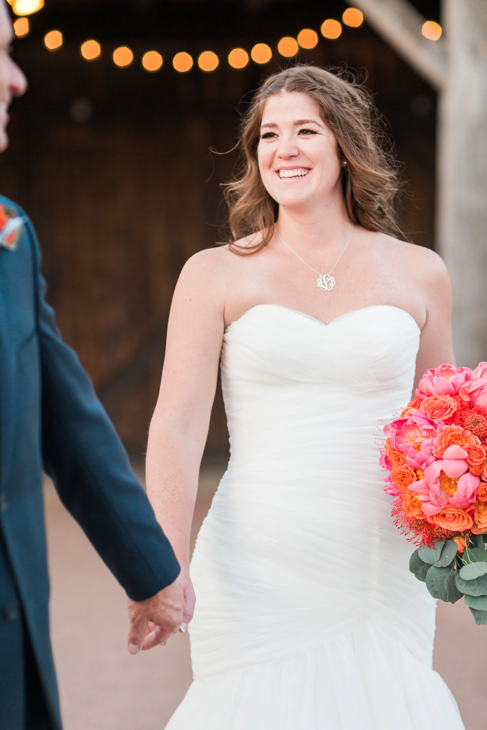 Groom leading his bride to their reception! 