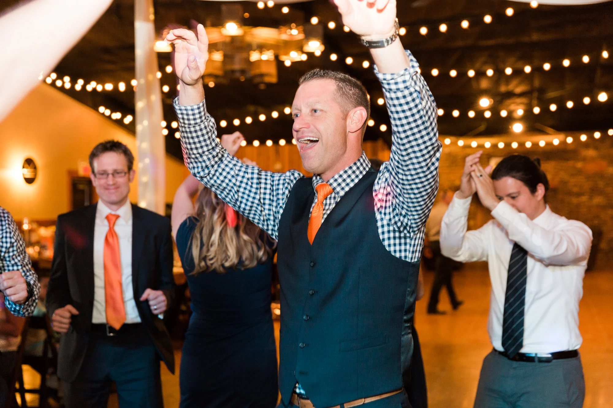 Groom dancing at reception