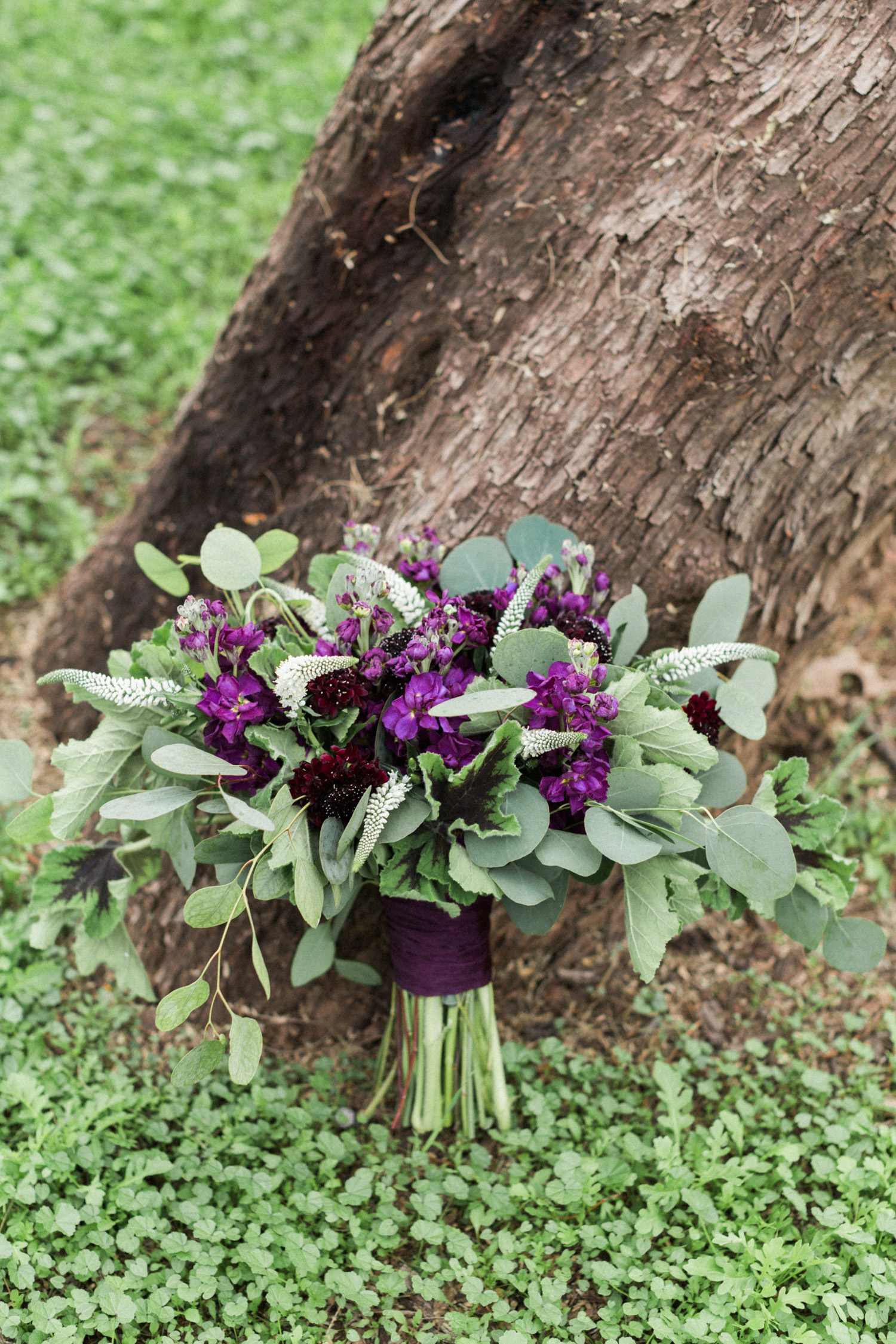 Gorgeous, romantic purple and burgundy bouquet filled with greenery by the talented Butterfly Petals! 