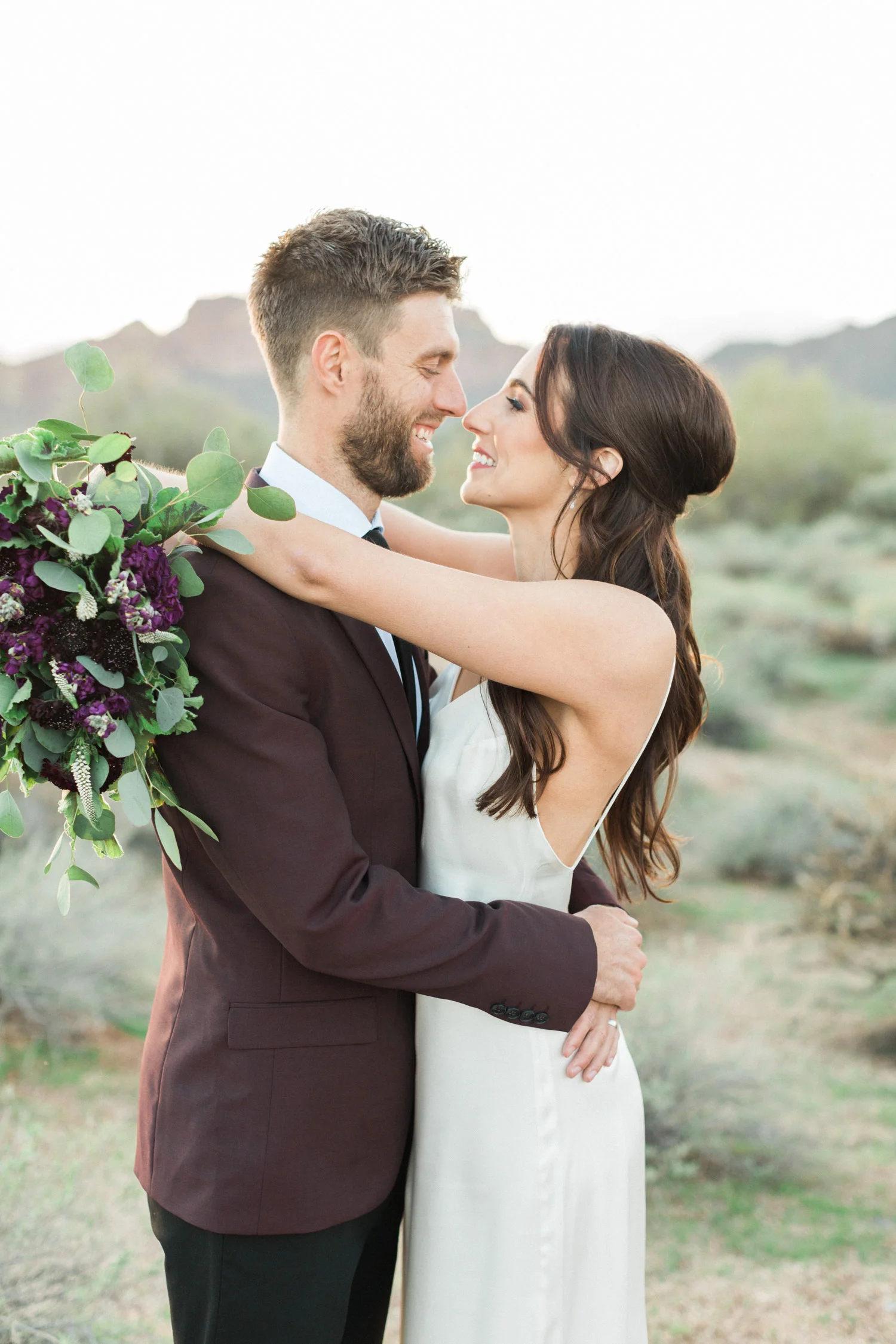 Beautiful couple smiling at each other on the day of their elopement in Phoenix, AZ.